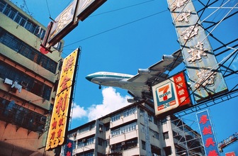 Cathay Jumbo approaching Kai Tak Airport over Kowloon City